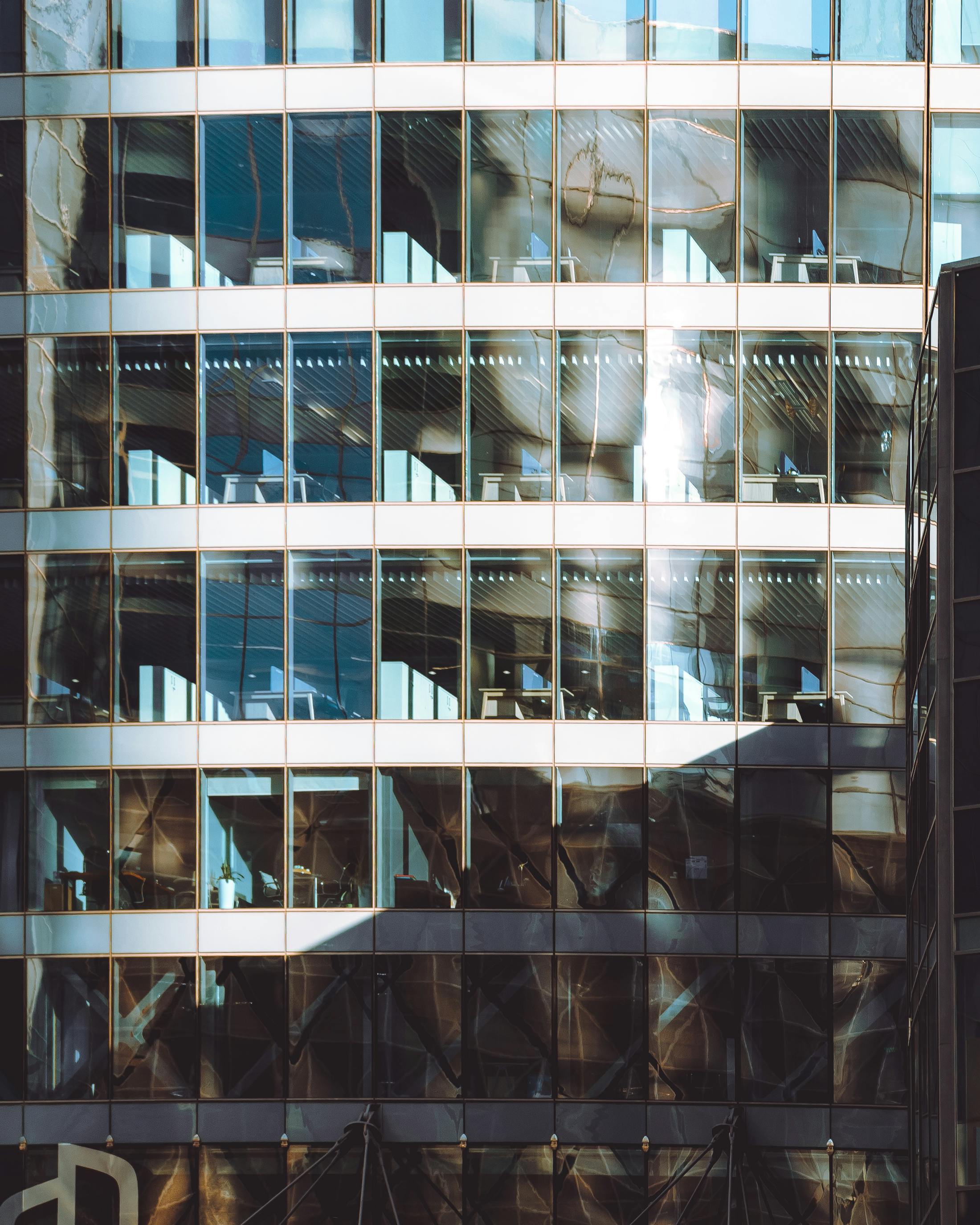 Modern office facade with geometric glass patterns