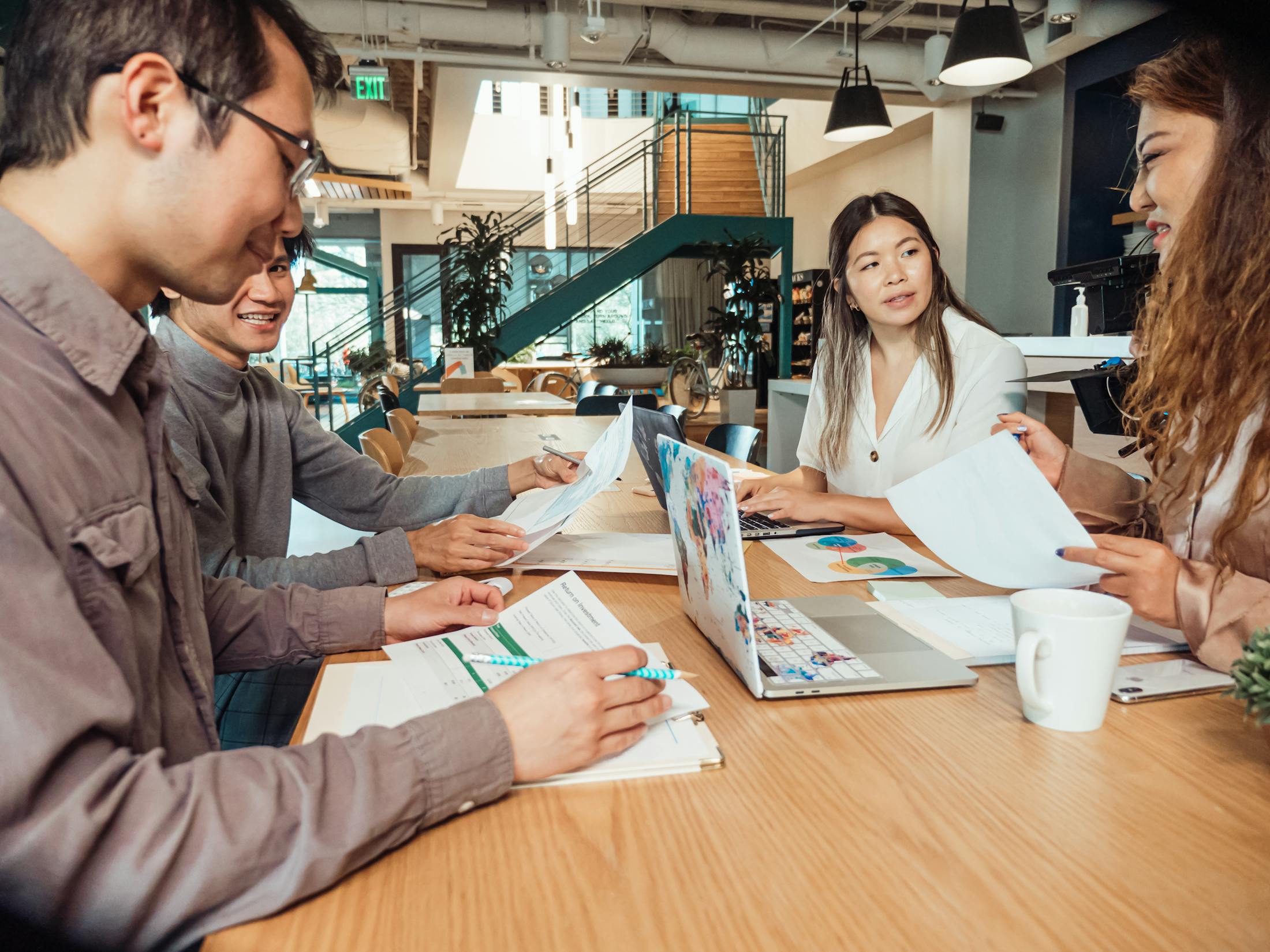 Professionals reviewing plans together in a modern office